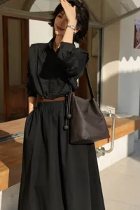 Dark brown genuine leather bucket bag, chic commuter shoulder bag for women, large capacity.