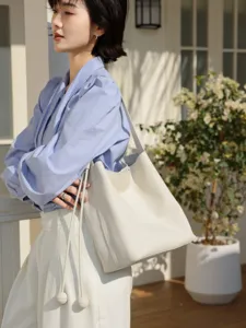 Genuine leather bucket bag, chic commuter shoulder bag with large capacity for women.