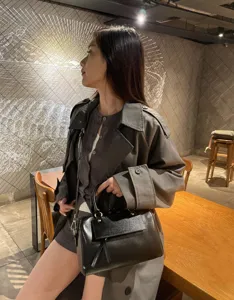 Elegant black leather Boston shoulder handbag, premium casual crossbody bag for women daily use.
