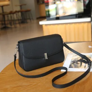 Classic black leather crossbody bag for women, stylish genuine cowhide shoulder bag.