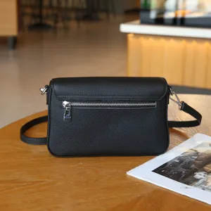 Black genuine leather crossbody bag for women, stylish shoulder bag with zipper pocket.