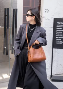 Brown woven leather shoulder crossbody bag for women, stylish casual real leather bucket handbag.