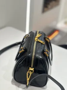 Classic black oil-wax genuine leather Boston handbag with gold-tone hardware and zipper.