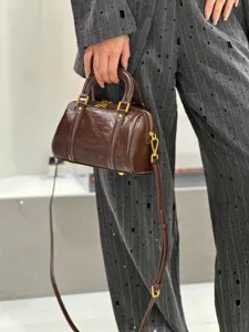 Vintage oil-wax leather Boston handbag for women, chic crossbody shoulder bag with metal hardware.