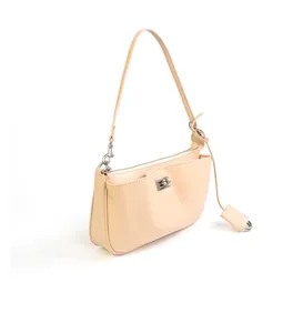 Detailed view of beige leather shoulder bag with front turn-lock pocket and metal hardware.