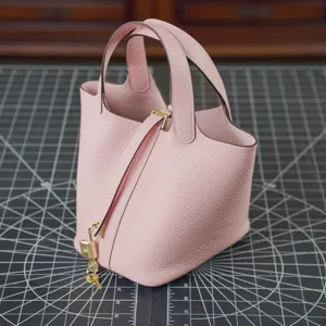 Pink leather bucket handbag for women, stylish top layer cowhide casual tote and purse.