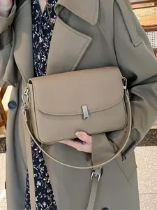 Stylish women genuine leather crossbody bag, elegant taupe shoulder handbag with metal lock.