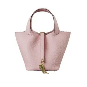 Pink genuine leather bucket bag chic handbag with padlock and top handle for women.