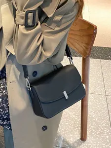 Stylish women's genuine leather shoulder bag, versatile black crossbody bag for daily wear.