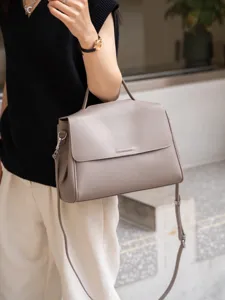 Elegant taupe leather top handle shoulder bag for women, versatile large capacity commute crossbody.