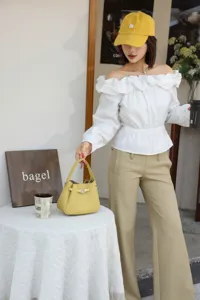 Mini genuine leather bucket bag, classic structured handbag with top handle for casual daily wear.