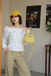 Mini leather bucket bag with top handle and strap for women stylish casual crossbody use