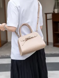 Chic beige leather shoulder handbag, stylish crossbody tote for women, minimalist daily commuter.