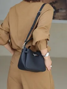 Mini cowhide Kelly handbag and shoulder bag, versatile casual leather bag for women.