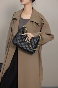 Black quilted leather shoulder bag for women, luxury style underarm hobo bag with gold chain.