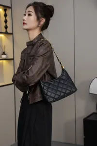 Black quilted leather shoulder bag with gold chain strap for women chic daily use