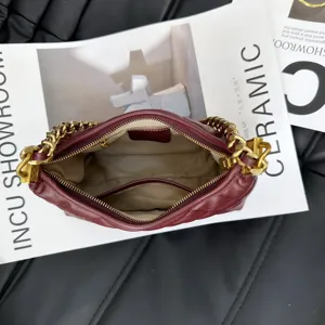 Top layer cowhide chevron quilted shoulder bag with chunky gold chain strap fashion.