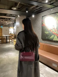 Women's genuine leather Boston cross-body handbag, stylish burgundy handbag with shoulder strap.
