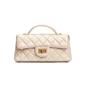 Elegant quilted leather top handle bag with vintage turn lock design for women chic style.