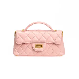 Pink quilted leather top handle mini flap bag with classic turn-lock closure and elegant style.