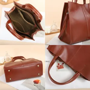 Classic brown leather tote bag for women, vintage shoulder handbag with multiple interior pockets.