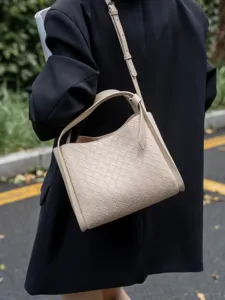 Beige woven leather shoulder crossbody bag for women, chic bucket handbag for spring summer.