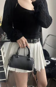 Detailed view of the stylish black leather boston handbag, perfect women crossbody bag for daily.