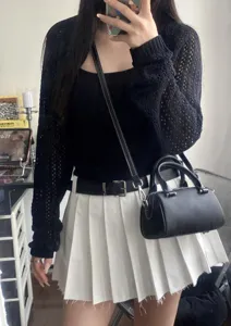 Black leather Boston shoulder bag for women, stylish crossbody handbag with top handles.