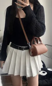 Brown leather mini Boston bag, chic crossbody handbag with shoulder strap for women stylish daily use.