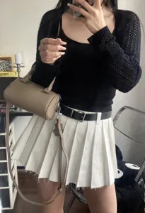 Stylish genuine leather Boston handbag, detail shot showing crossbody and hand-held styling.
