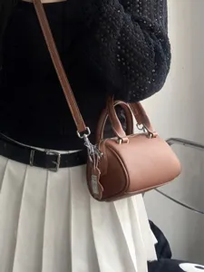 Stylish leather boston shoulder bag for women, chic small handbag and crossbody bag.