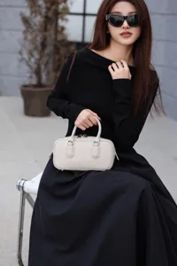 Elegant leather Boston handbag for women, chic small pillow shoulder bag, stylish daily purse.