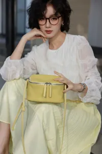 Genuine leather crossbody bag for women, mini square lunch box design with adjustable strap.