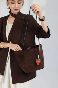 Genuine leather brown bucket bag for women, large capacity stylish tote bag with cute strawberry charm.