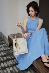 Detailed view of the simple genuine leather tote bag with unique bead charm, elegant daily style.