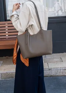 Detailed view of the premium genuine leather tote bag, solid color minimalist style.