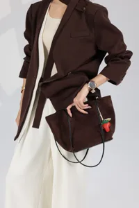 Brown suede shoulder tote bag, large capacity bucket handbag with cute strawberry charm.