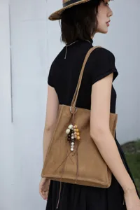 Genuine leather brown tote bag for women large capacity shoulder commuter bag with beaded charm.