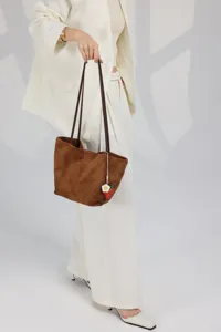 Premium leather tote bag with large capacity, featuring minimalist design for daily wear and work.