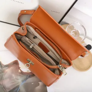 Premium leather shoulder bag for women, elegant retro crossbody handbag with metal lock.