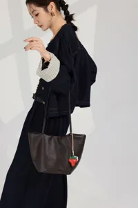 Genuine leather women's tote bag, large capacity stylish shoulder bucket bag with cute charm.