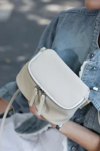 Mini white leather crossbody bag, soft cowhide minimalist lunchbox purse for daily use.