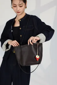 Genuine leather bucket bag with cute strawberry charm, large capacity brown shoulder tote.