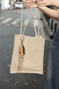 Minimalist genuine leather tote bag for women, large capacity shoulder bag with bead charm.