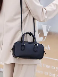 Black leather boston bag vintage style top handle shoulder handbag for women stylish chic.