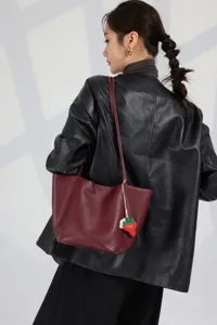 Burgundy leather tote bag for women, large capacity shoulder bag with cute strawberry charm.