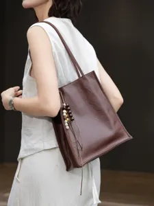 Genuine leather minimalist tote bag for women, large capacity shoulder bag for daily commute.