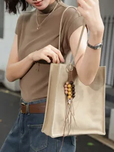 Minimalist genuine leather tote bag for women, large capacity stylish casual shoulder bag.