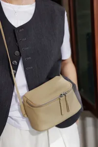 Mini genuine leather crossbody bag, minimalist lunch box shoulder bag for women daily travel.