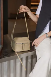Minimalist genuine leather mini crossbody bag for women, stylish box shoulder bag for daily travel.